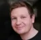 Headshot of Jaymeh with slightly smiling face